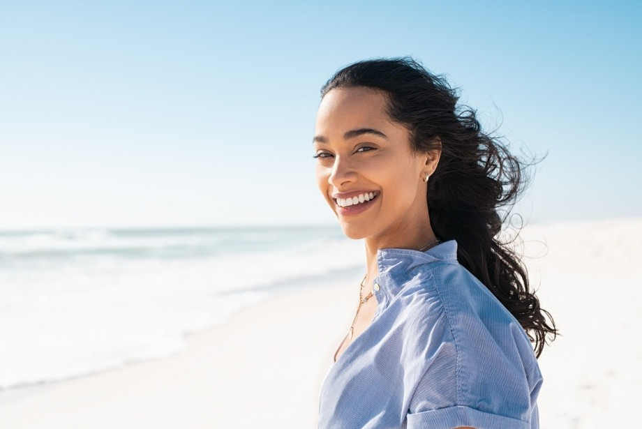 Smiling woman enjoying the outdoors with a healthy, confident smile